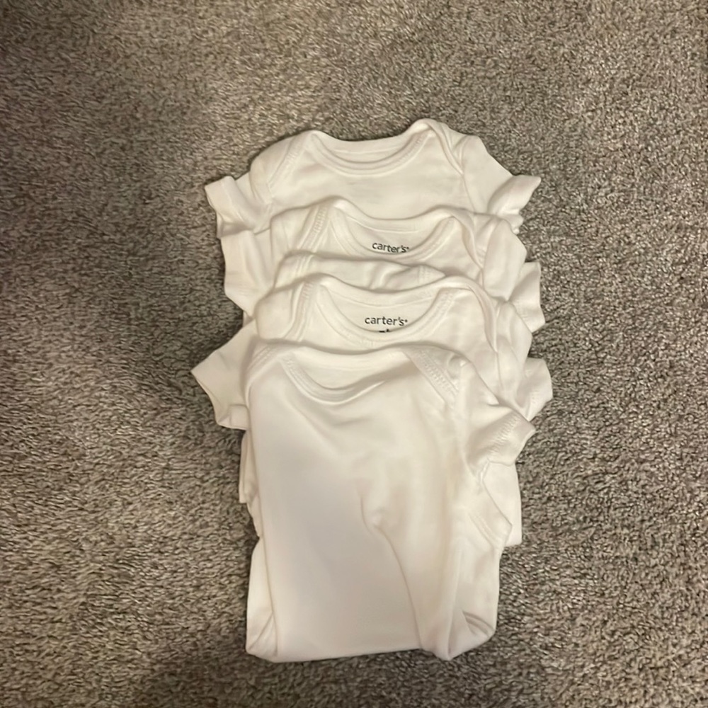 Never worn white Carters bodysuits